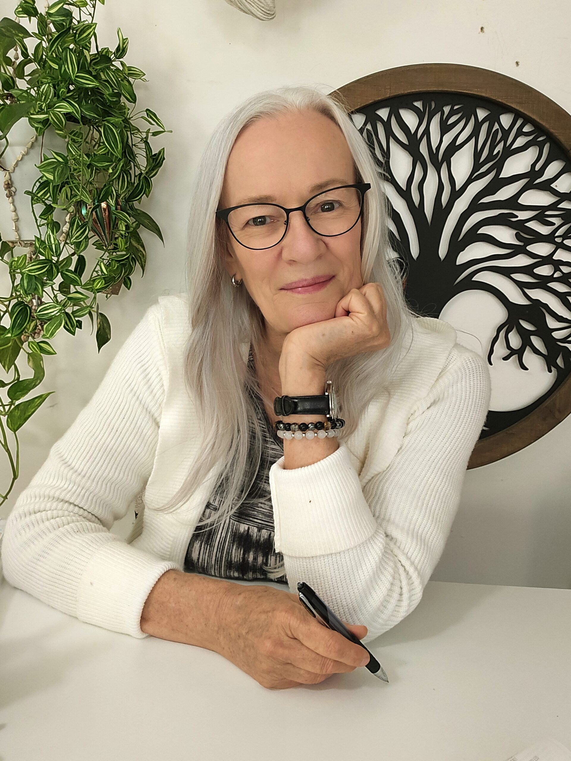 Judy K. Martene smiling at her desk