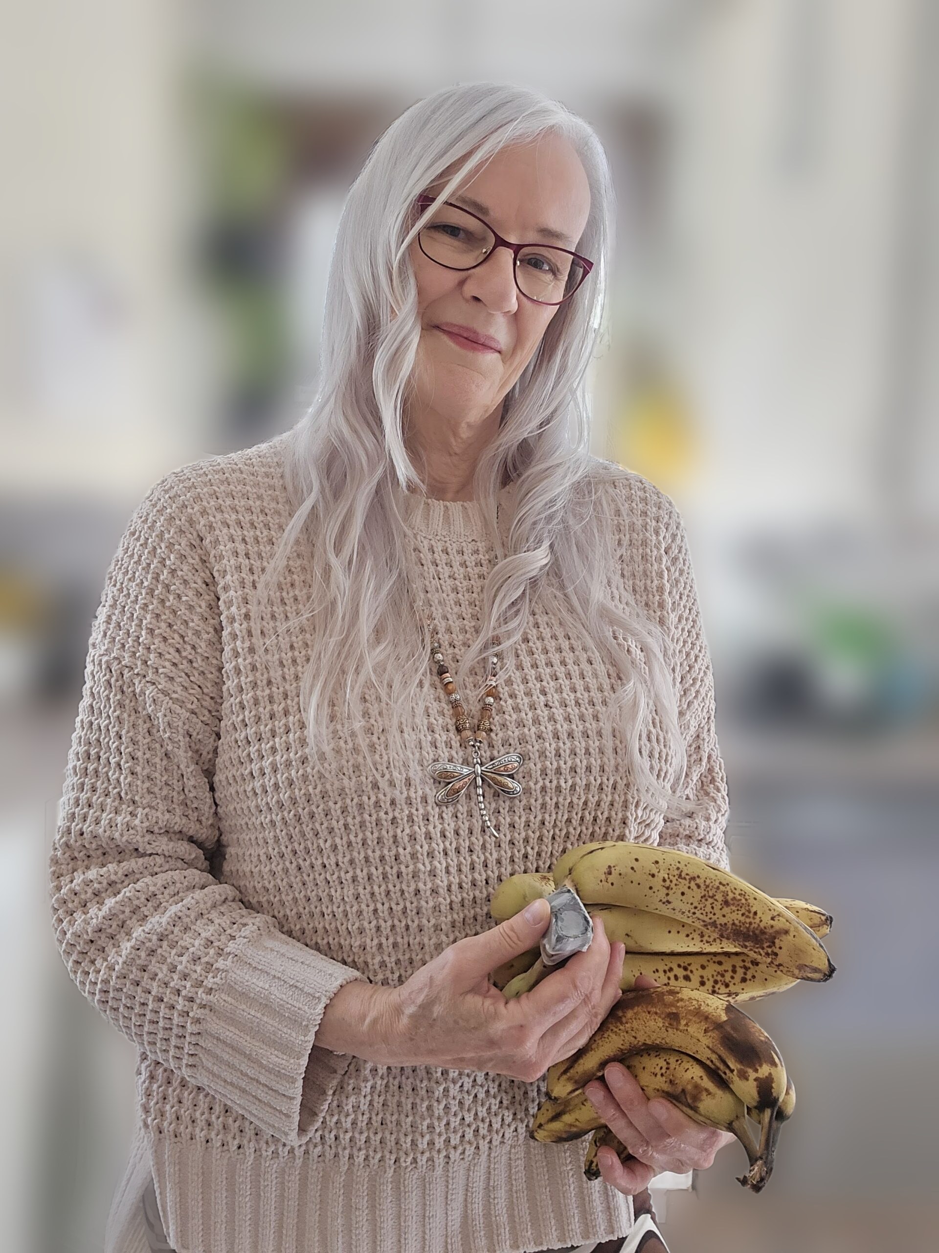 Judy K. Martene in her kitchen holding bananas